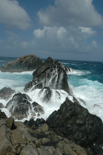 Waves Against Basalt Rock